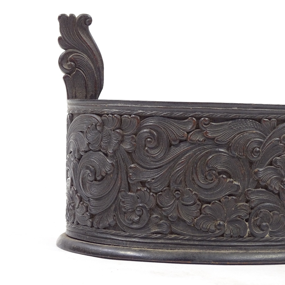 A Scandinavian 19th century oval stained wood bowl, with relief carved acanthus leaf decorated