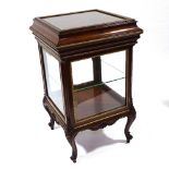 A fine quality late 19th century mahogany vitrine cabinet with bevel-glass panels, rising top and