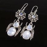 A pair of sterling silver cabochon moonstone figural spider and web pendant earrings, height