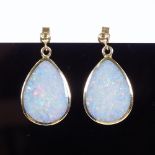 A pair of 9ct gold cabochon opal double-sided drop earrings, stud fittings, maker's marks MD, height