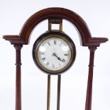 An Edwardian mahogany and brass rise and fall winding mantel clock by Long & Co of Cardiff, height