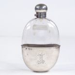 A silver-mounted curved-glass hip flask, locking cap with removable cup and gilt interior, by