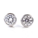 A pair of 18ct white gold 0.5ct solitaire diamond earrings, each diamond approx 0.25ct, stud