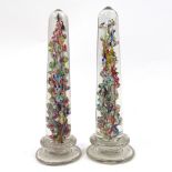 A pair of Victorian glass columns with multi-colour internal glass decoration, height 30cm