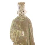 A Chinese Han dynasty standing figure with traces of original paintwork, height 22cm Damaged hand,