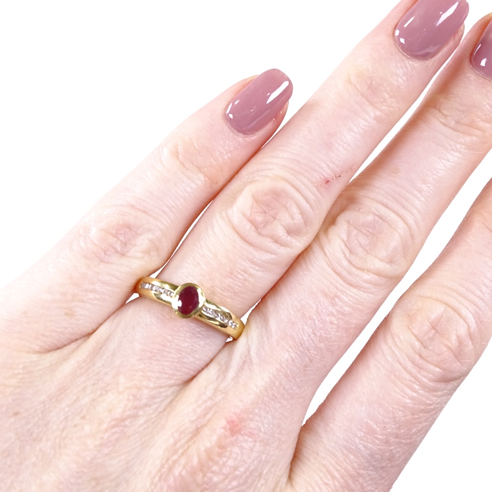 An 18ct gold ruby and diamond band ring, channel set diamond shoulders, setting height 6.2mm, size - Image 4 of 4