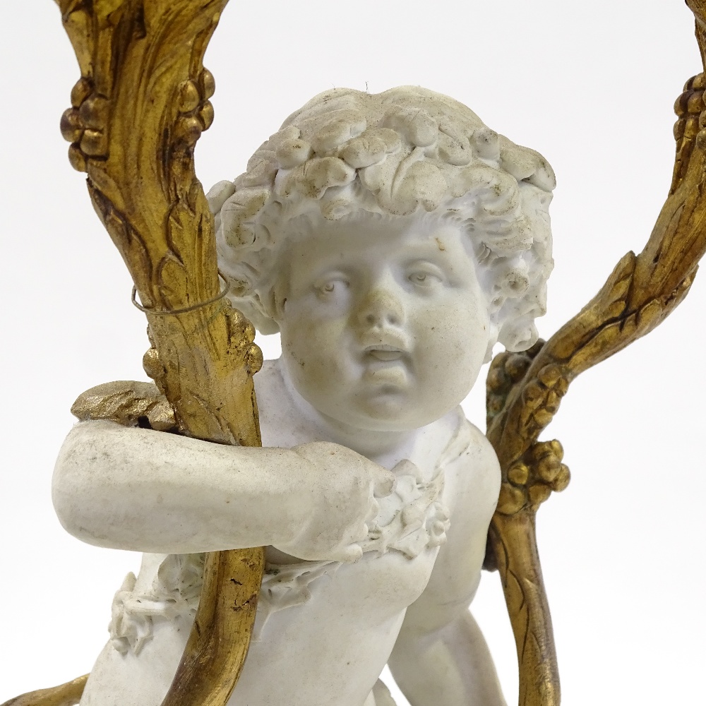 A 19th century bisque porcelain and ormolu-mounted twin-branch candelabrum on fluted yellow marble - Image 7 of 7