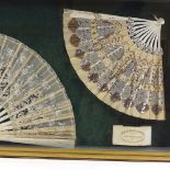 2 19th century carved and pierced bone fans with silk screens, together with a label for Dickins &