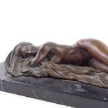 A bronze reclining female nude, unsigned, on black marble base, length 31cm