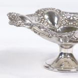 An Edwardian silver pedestal bon bon dish, textured relief embossed and pierced floral decoration,