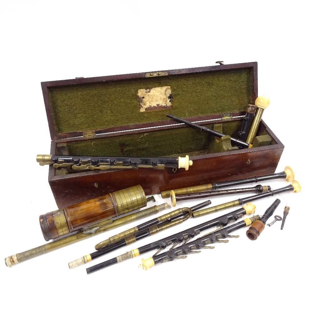 A collection of 18th and 19th century musical instrument parts, bagpipe chanters etc, including