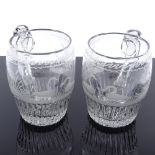 A pair of 18th century glass barrel-shaped tankards, with wheel engraved swan designs, height 11cm