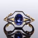 An Art Deco 18ct gold solitaire Ceylon blue sapphire dress ring, openwork settings, setting height