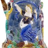 A large Minton Majolica Pottery lidded jug, with relief decorated Medieval dancers, height 33cm