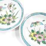 A pair of Chinese porcelain plates decorated with butterflies and flowers, diameter 20cm