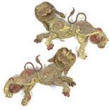 A pair of Indian relief carved and painted wood ornamental dragons, length 46cm