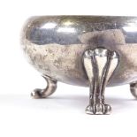 A 19th century Russian silver salt cellar, plain circular form with lion paw feet, 84 Zolotnik