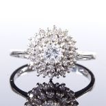 A 9ct white gold diamond cluster ring, central stone approx 0.3ct, maker's marks V&Co, hallmarks are