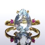 An 18ct gold 3-stone pear-cut aquamarine and ruby dress ring, aquamarine length 10.8mm, size L, 2.1g