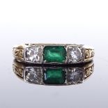 A 14ct gold 3-stone emerald and diamond ring, scroll engraved shoulders and bridge, total diamond