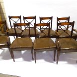 A set of 8 leather-upholstered mahogany dining chairs, with satinwood inlaid backs