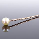 An unmarked gold whole-pearl stick pin, pearl diameter 6.2mm, overall length 67.5mm, 1.3g Very