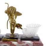 A 19th century marble desk stand, surmounted by a bronze cherub incorporating stripe glass shell-