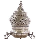 A Turkish Ottoman unmarked silver incense burner, height 17cm, diameter 16cm Lightly dented, feet