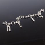 GUCCI - a sterling silver charm bracelet, 4 silver charms, bracelet length 20.5cm, 33.9g, RRP £180