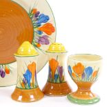 A Clarice Cliff for Newport Pottery Crocus pattern sandwich plate and pair of cruet pepperettes, and
