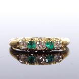 An 18ct gold 5-stone emerald and diamond half hoop ring, total diamond content approx 0.2ct, maker's
