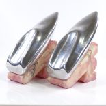 A pair of Art Deco Riva aluminium and pink marble speedboat design bookends, height 17cm