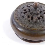 A Chinese patinated bronze incense bowl and cover, with relief cast lid, impressed seal mark under