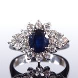 An 18ct white gold sapphire and diamond cluster dress ring, total diamond content approx 0.5ct,