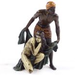A cold painted bronze sculpture of an African man and woman, bears Bergman stamp, height 14cm