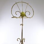 A late Victorian brass music stand, maker's marks WT and S, registered no. 195464