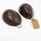 2 19th century polished coconut shells with unmarked white metal mounts, one bearing an old