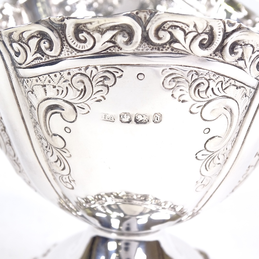 A late Victorian silver swing-handled basket, oval form with relief embossed foliate decoration - Image 3 of 3