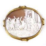 A Victorian large relief carved shell cameo brooch, depicting people gathering to watch a miracle,