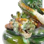 A Chinese sancai treacle glaze dragon entwined ceramic vase, height 37cm