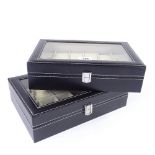 2 black leather 12-section watch boxes, with glass viewing lid, length 30.5cm (2)