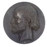 A 19th century patinated bronze relief plaque depicting the head of a man, unsigned, with Eck &