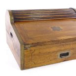 A 19th century brass-bound camphorwood travelling writing box, with tambour top section and single