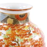 A Japanese white glaze porcelain vase, with painted and gilded tree decoration, height 30cm, on