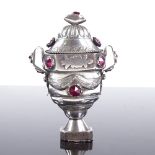 A Danish unmarked silver ruby marriage box, hinged lid and base with bright-cut swag decoration,