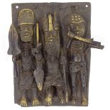 A Benin style relief bronze plaque depicting 3 warriors, height 29cm