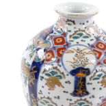 A Chinese famille rose porcelain vase, hand painted enamel decoration and gilded hares, height 21cm