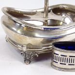 A Victorian silver table condiment set stand, and a silver oval cruet with blue glass liner, stand