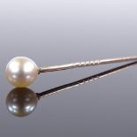 An unmarked gold whole-pearl stick pin, overall length 62.1mm, 1.4g Very good original condition,