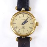 GUCCI - a lady's Vintage gold plated quartz wristwatch, champagne dial with Roman numeral hour